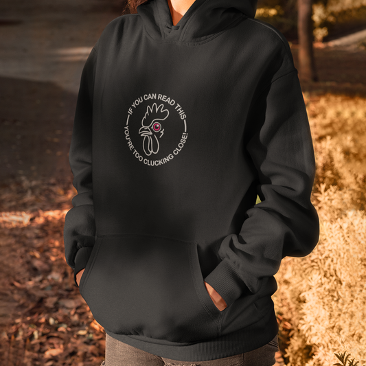 IF YOU CAN READ THIS YOU’RE TOO CLUCKING CLOSE! EMBROIDERED UNISEX HEAVY BLEND HOODIE