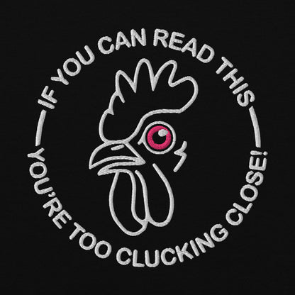 IF YOU CAN READ THIS YOU’RE TOO CLUCKING CLOSE! EMBROIDERED UNISEX HEAVY BLEND HOODIE